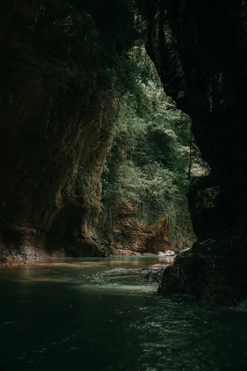 A boat on the river inside Martvili Canyon